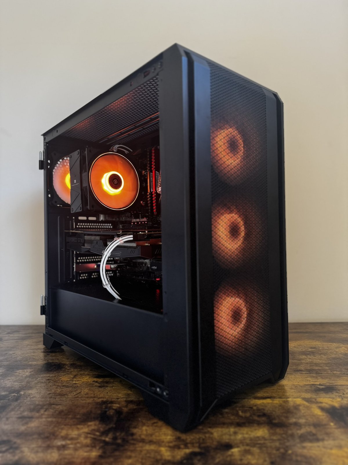 Side angle of a completed PC build, orange ARGB lighting