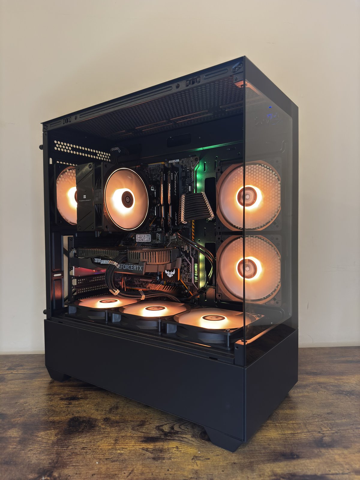 Side angle of a completed PC build with visible GPU and cooler